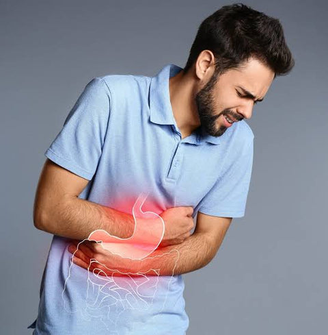 Man holding his stomach in discomfort