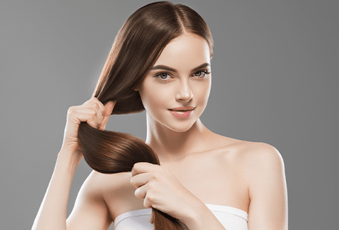 Woman holding long healthy hair